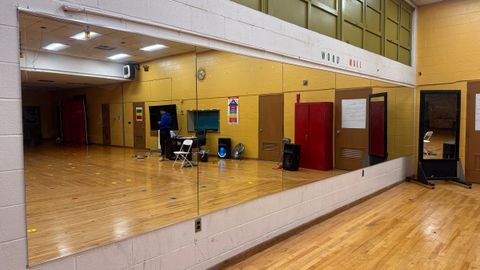 Full-wall mirror installed in a dance studio