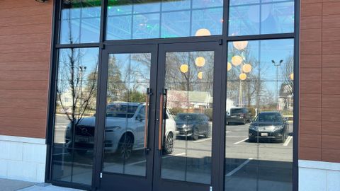 Storefront glass and entrance doors after replacement by Stonewing